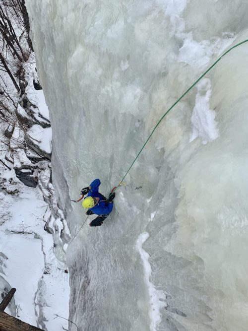 a photo of erik on an ice climbing face called goats foot