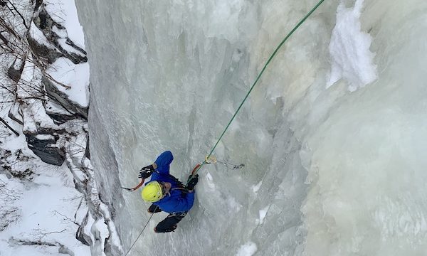a photo of erik on an ice climbing face called goats foot