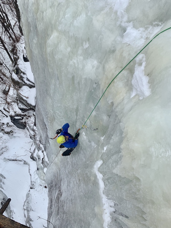 a photo of erik on an ice climbing face called goats foot