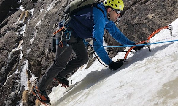a photo of erik weihenmayer climbing into sunshine