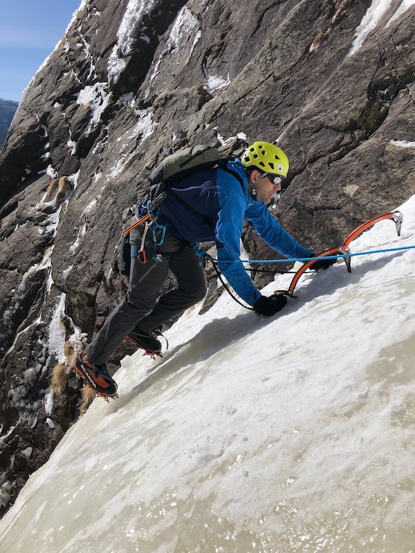 a photo of erik weihenmayer climbing into sunshine