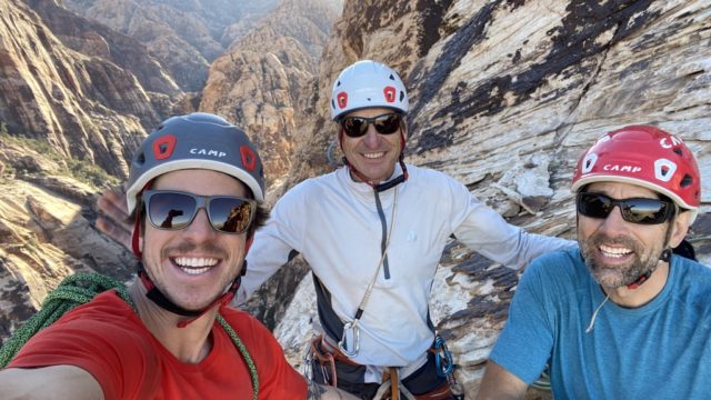 Connor, Charley, and Erik taking a selfie mid-climb.